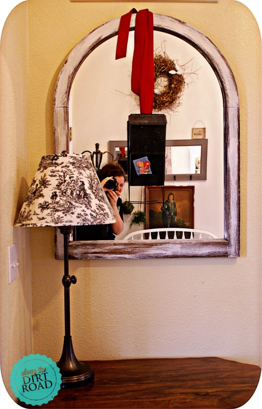 I decided to hang it from a red ribbon on the mirror in the entry.