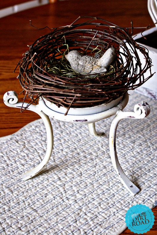 This little iron stand is one of my favorites.  I love it's chippyness and the fact that it can be used for so many things.  I think that I gave a dollar or two for it.